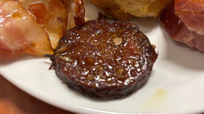 Golden Corral sausage patty on white plate