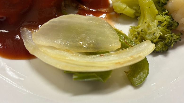 Golden Corral sautéed peppers and onions on white plate