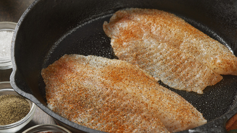 Tilapia fillets in a pan