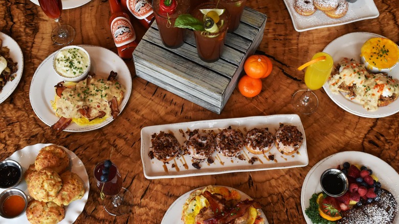 Aerial view of a table at Chef Art Smith's Homecomin', filled with many comfort food dishes