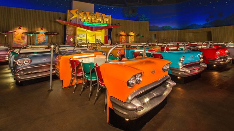 Sci-Fi Dine-In at Disney World featuring vintage cars that are used as dining tables