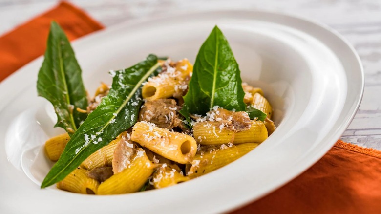 Pasta dish garnished with cheese and greens from Topolino's Terrace at Disney World