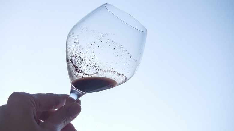 Wine sediment at the end of a glass
