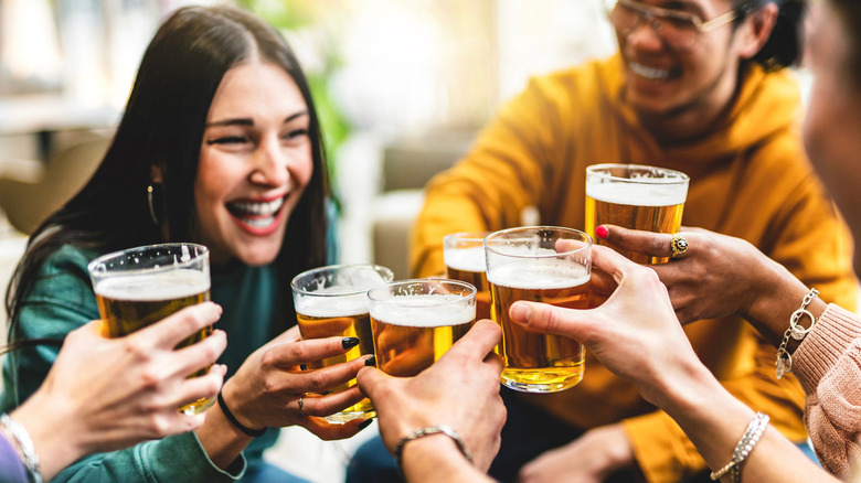 Group of friends with drink in hand