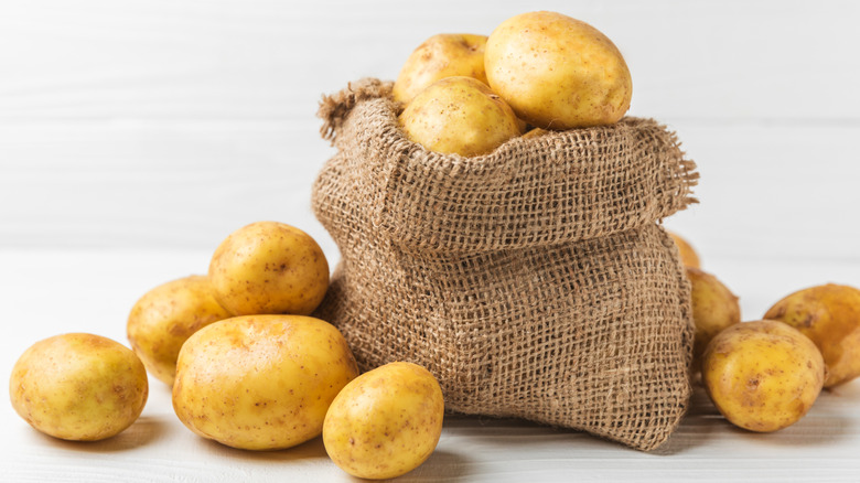 Overflowing bag of potatoes