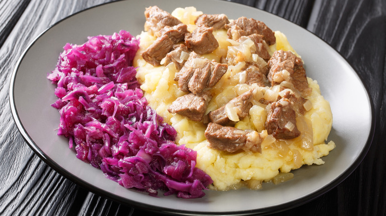 Traditional Dutch dish of hachee, beef and onion stew with red cabbage