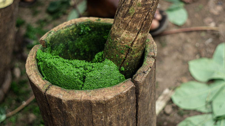 Cassava leaves being pounded