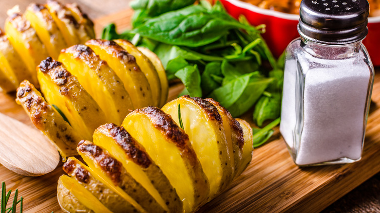 Hasselback potatoes on cutting board