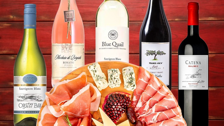 various wine bottle with charcuterie board