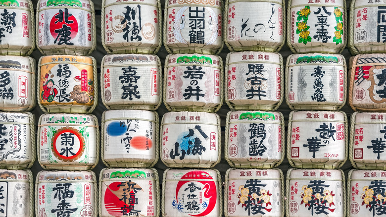 stacks of traditional wooden sake barrels