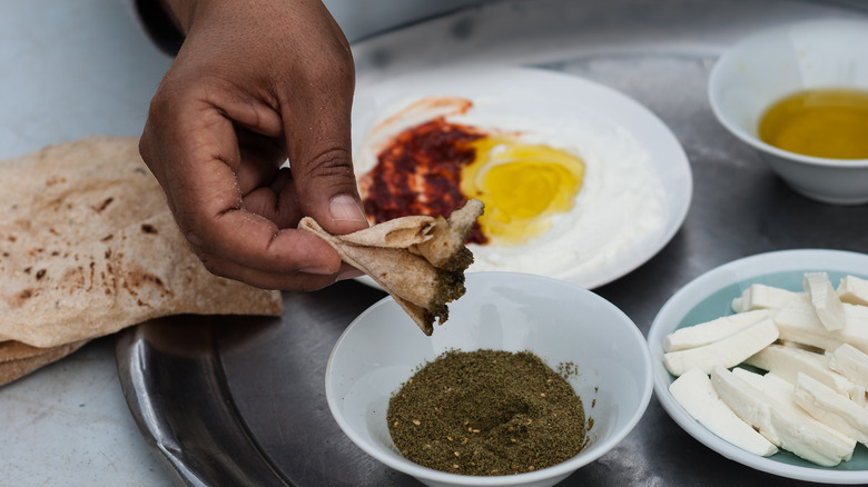 flatbread dipped in za'atar 