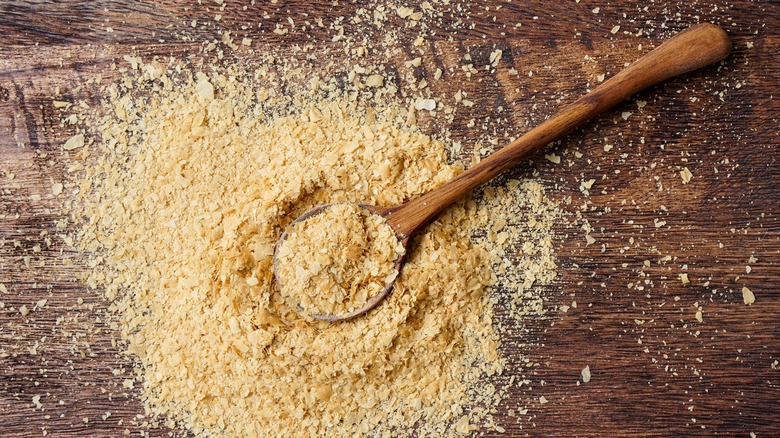 Nutritional yeast flakes with spoon