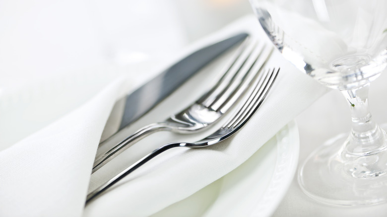 Silverware in a linen napkin