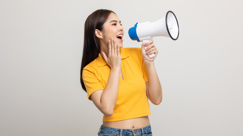 Woman yelling into megaphone