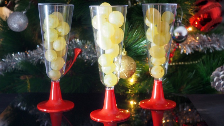 White grapes in wine glasses