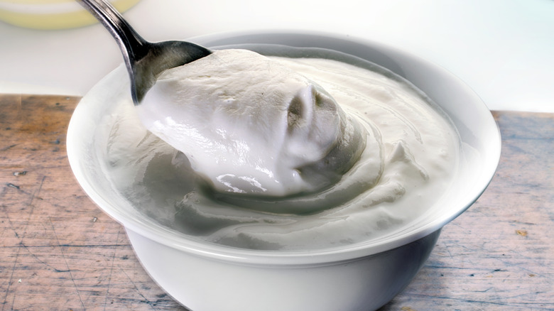 Sour cream in a bowl with a spoon