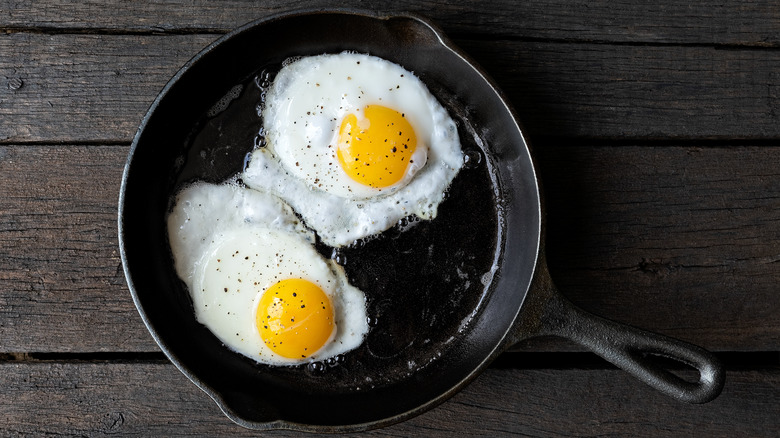 Two fried eggs in pan