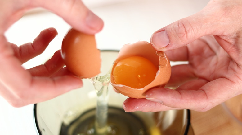 Cracking egg into bowl