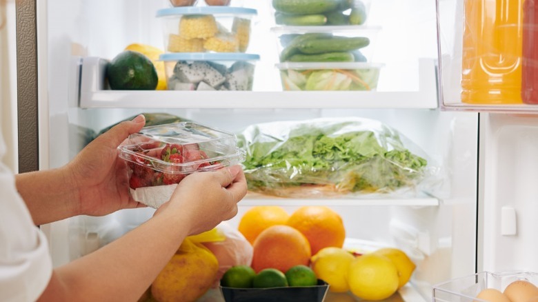 Fruit in store-bought and plastic containers