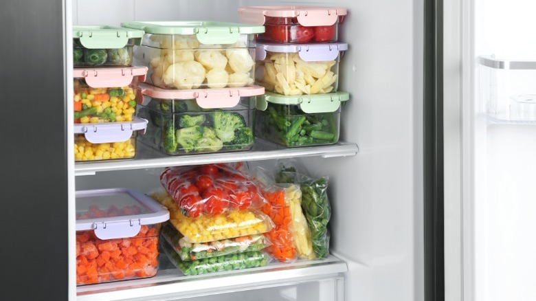 Fridge full of food containers and bags 