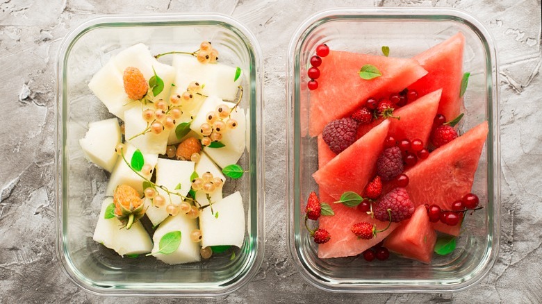 Fresh sliced fruit in glass containers