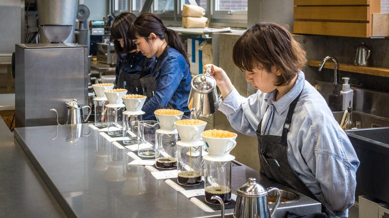 Baristas making pour-over coffee