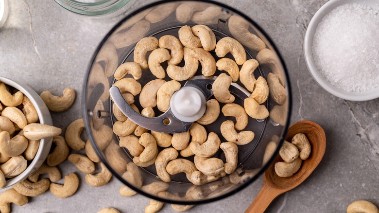 cashews in small food processor on marbel background