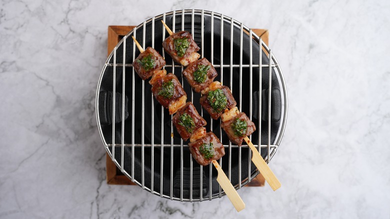 Beef skewers on a grill 