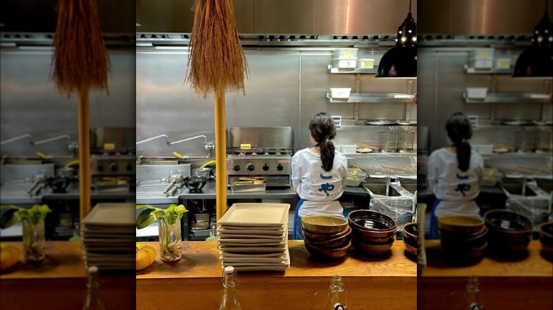 Woman in restaurant kitchen