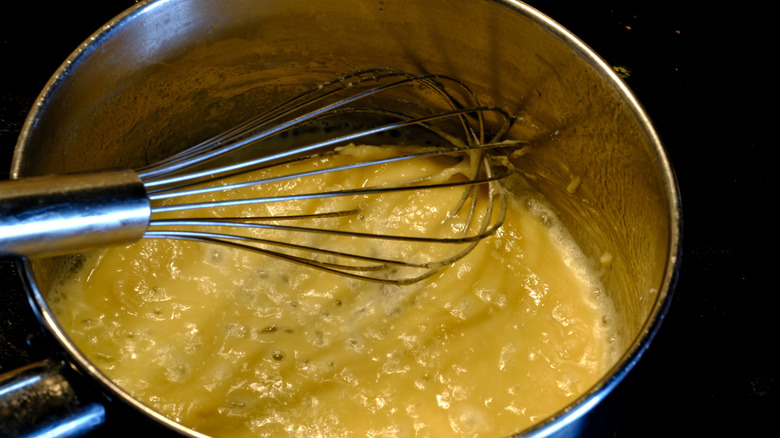 whisking roux in pot