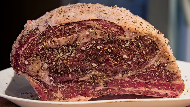 Seasoned raw prime rib roast