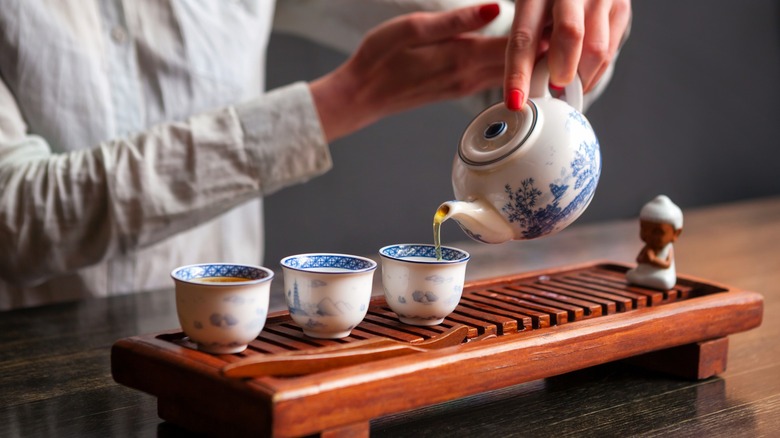 Woman pouring tea