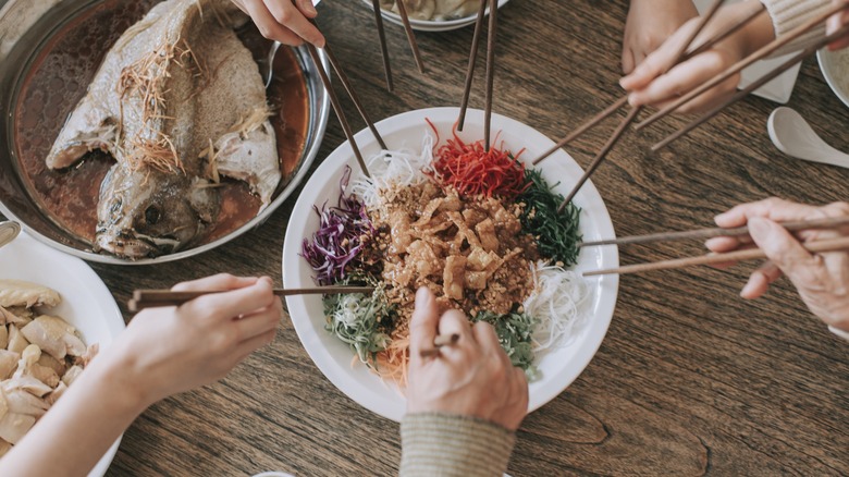 People eating with chopsticks