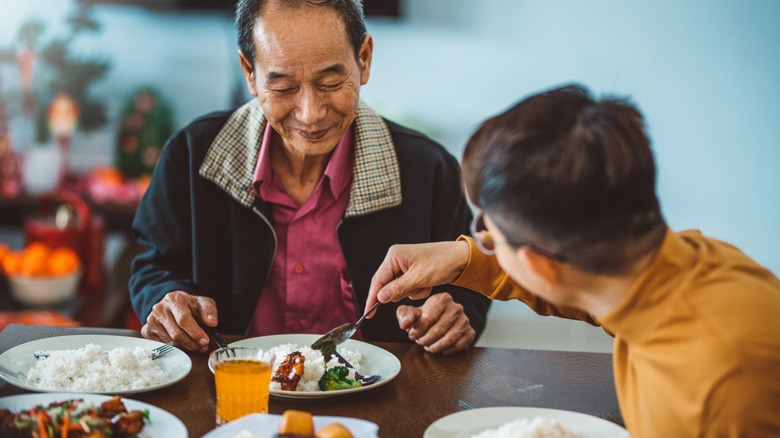 Chinese man serving father