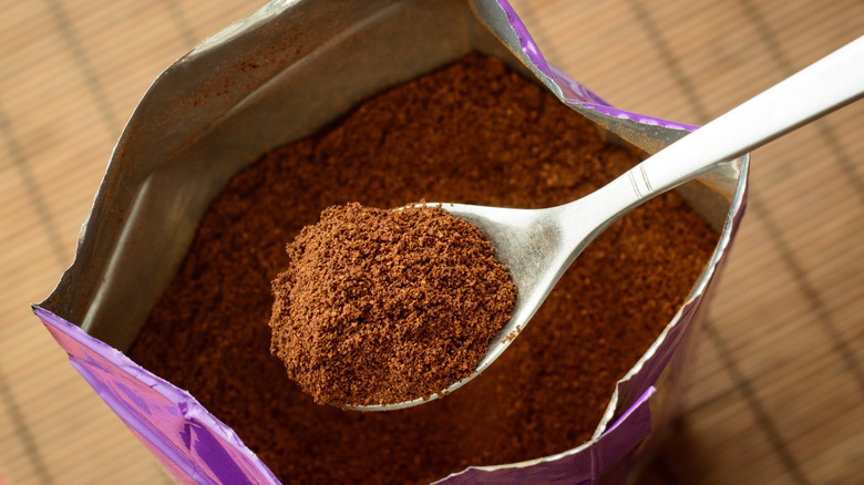 ground coffee on spoon