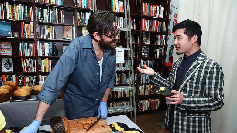 francis lam and a bookshelf