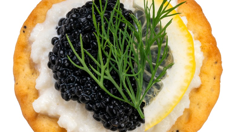 Crème fraîche with caviar on a cracker