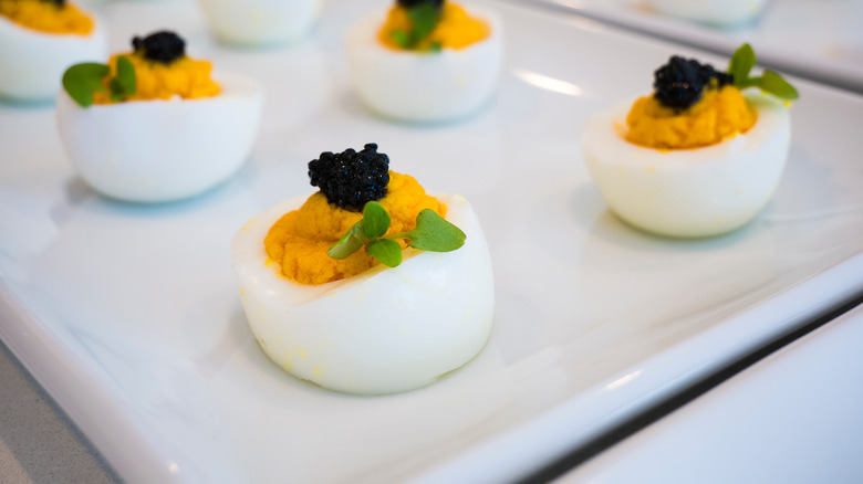 Deviled eggs topped with caviar