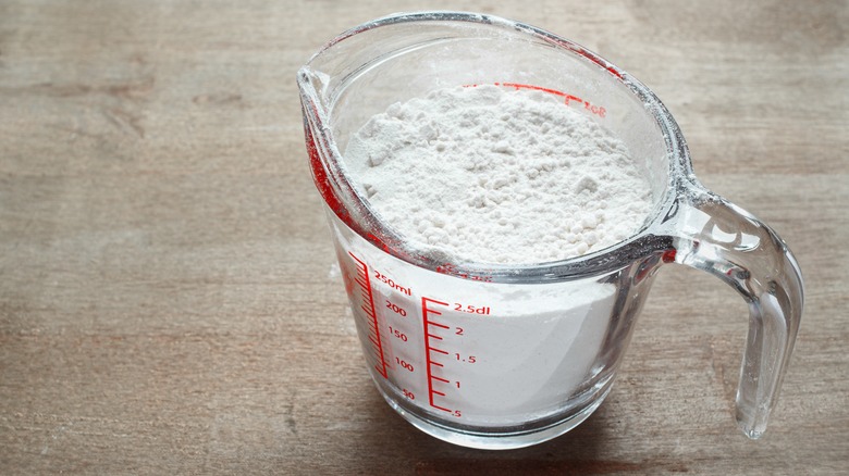 flour in liquid measuring cup