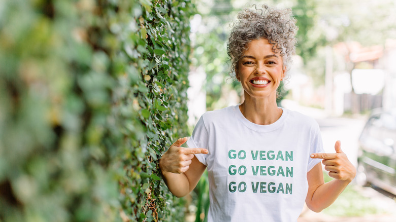 Person wearing go vegan tee shirt