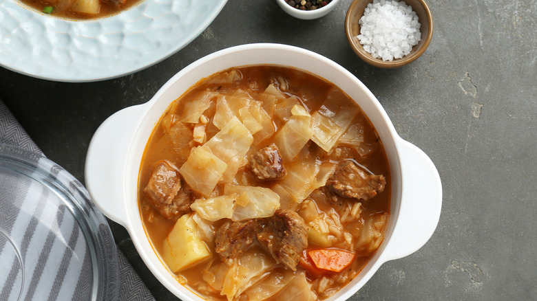 Overhead shot of beef soup in kitchenware