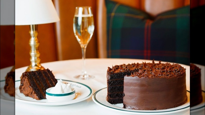 Chocolate cake slice and glass of champagne at The Polo Bar