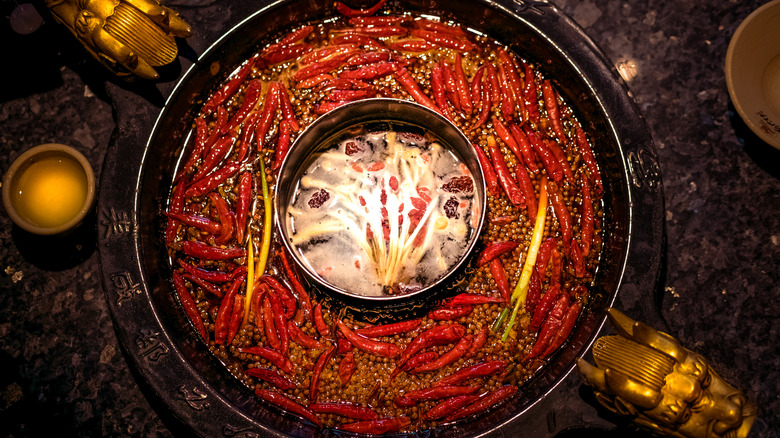 Hot pot filled with chilis