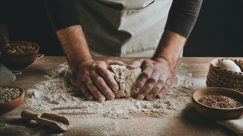 Hands kneading dough