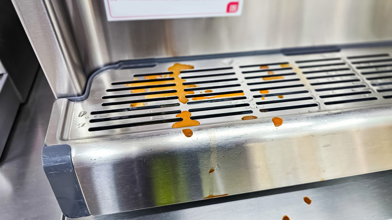 stained drip tray on espresso machine