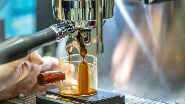 pulling espresso shot into glass