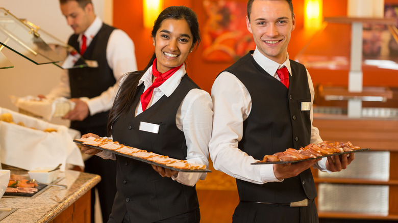 servers smiling at buffet restaurant 