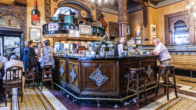 Customers in Café Iruña around the bar