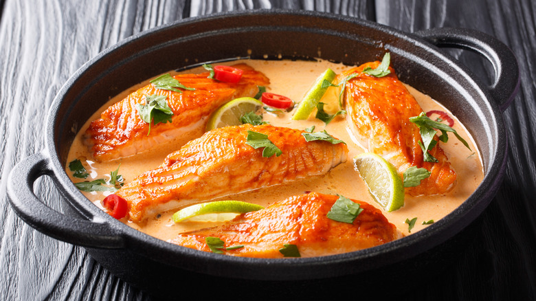 Thai-style salmon curry in cast iron pot