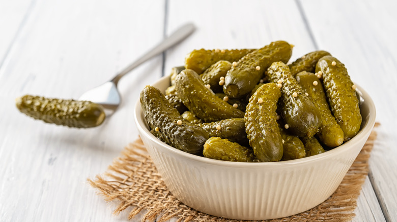 pickle gherkins in white bowl